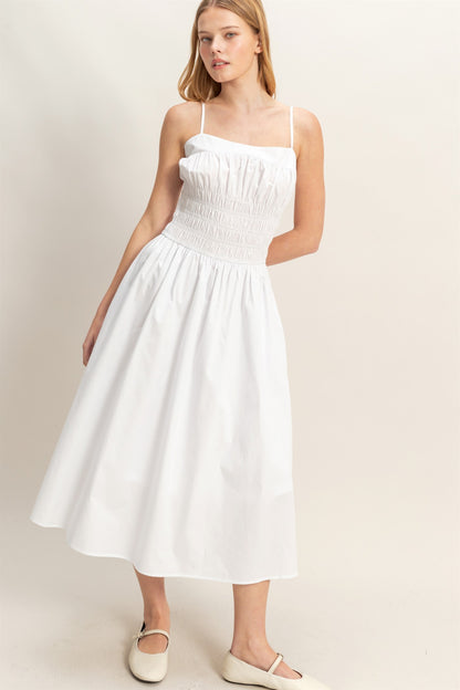 White Smocked Strapped Midi Dress with thin straps and a smocked bodice. Available in sizes XS–XL.