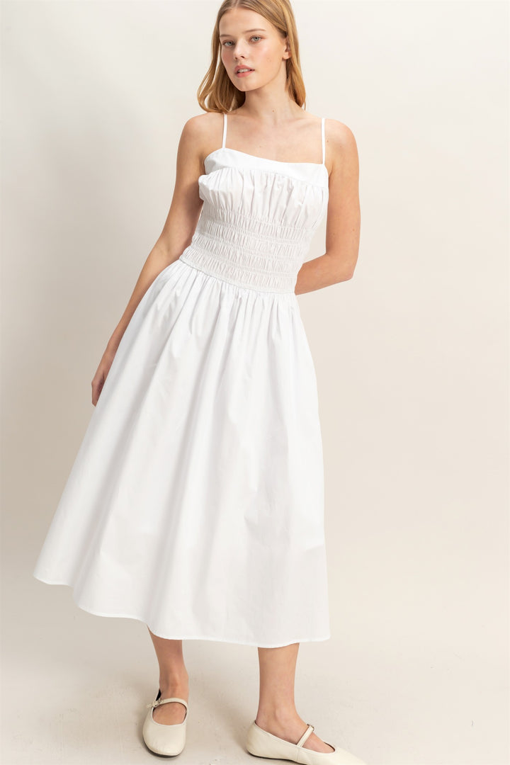 White Smocked Strapped Midi Dress with thin straps and a smocked bodice. Available in sizes XS–XL.