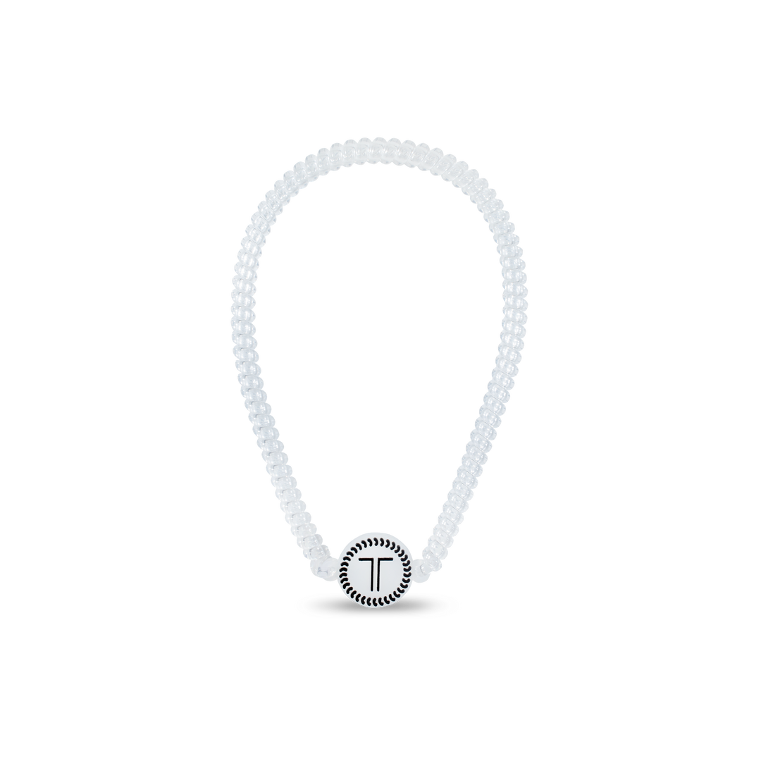 White beaded bracelet with a black "T" charm; available in small, medium, and large sizes.
