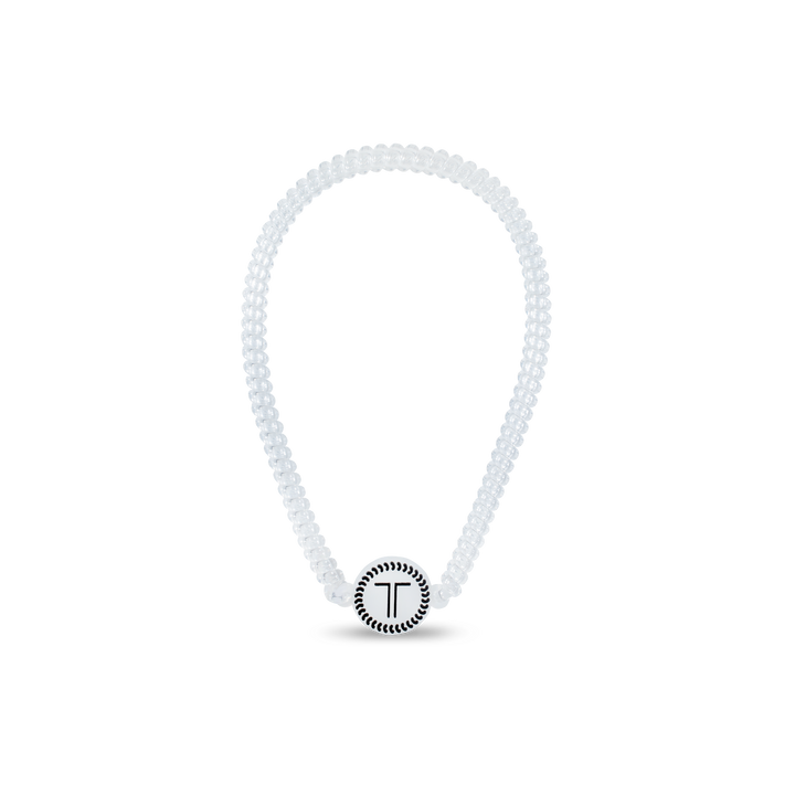 White beaded bracelet with a black "T" charm; available in small, medium, and large sizes.