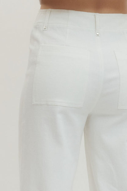 White HW Wide Leg Front Seam Pants with two square back pockets, silver rivets. Available in sizes XS-XL.