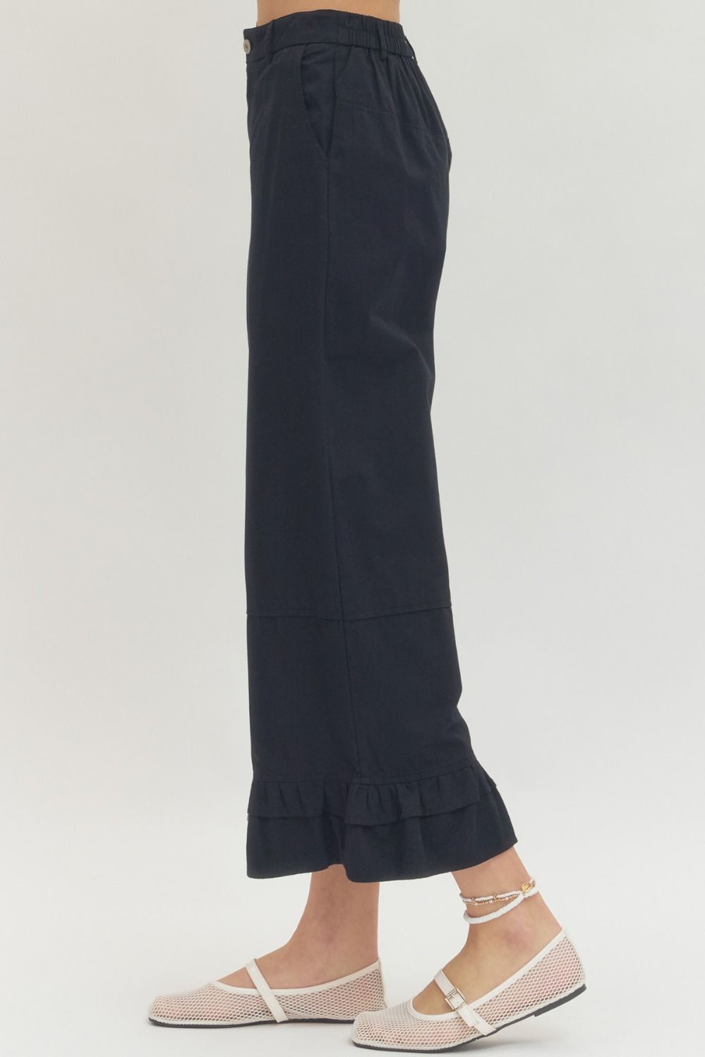 Black Straight Leg Ruffle Hem Pants available in sizes XS–XL.