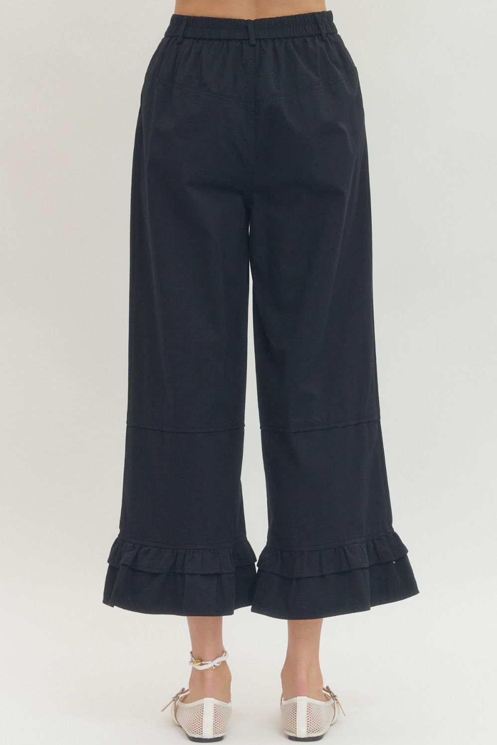 Black Straight Leg Ruffle Hem Pants, available in sizes XS-XL.