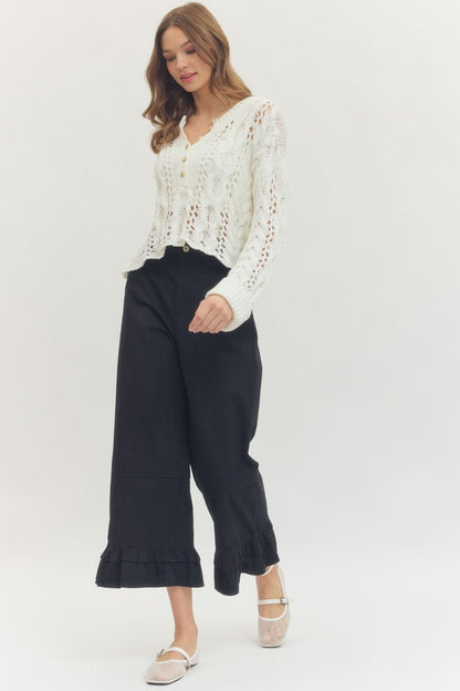 Black Straight Leg Ruffle Hem Pants; available in sizes XS-XL.