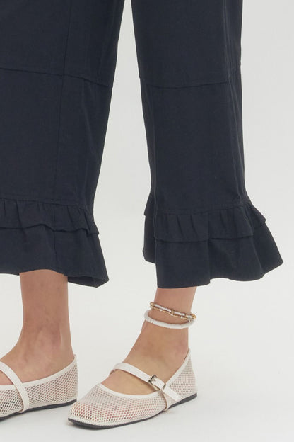 Black Straight Leg Ruffle Hem Pants; available in sizes XS-XL.
