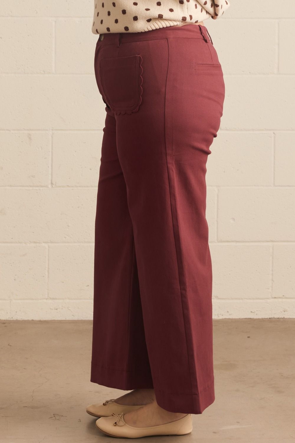Madelyn Scallop Wide Leg Pants in maroon with scallop trim pocket detail; available in sizes XS–XL.