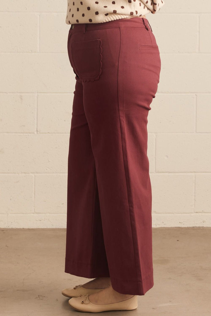 Madelyn Scallop Wide Leg Pants in maroon with scallop trim pocket detail; available in sizes XS–XL.