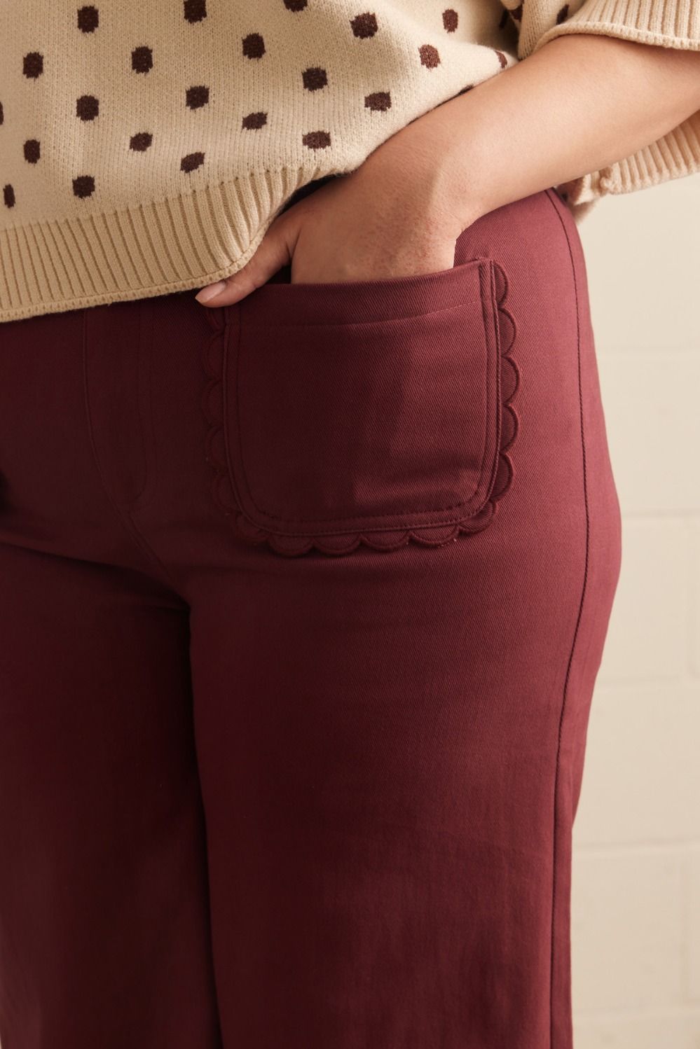Madelyn Scallop Wide Leg Pants in maroon with scallop trim pocket. Available in sizes XS–XL.