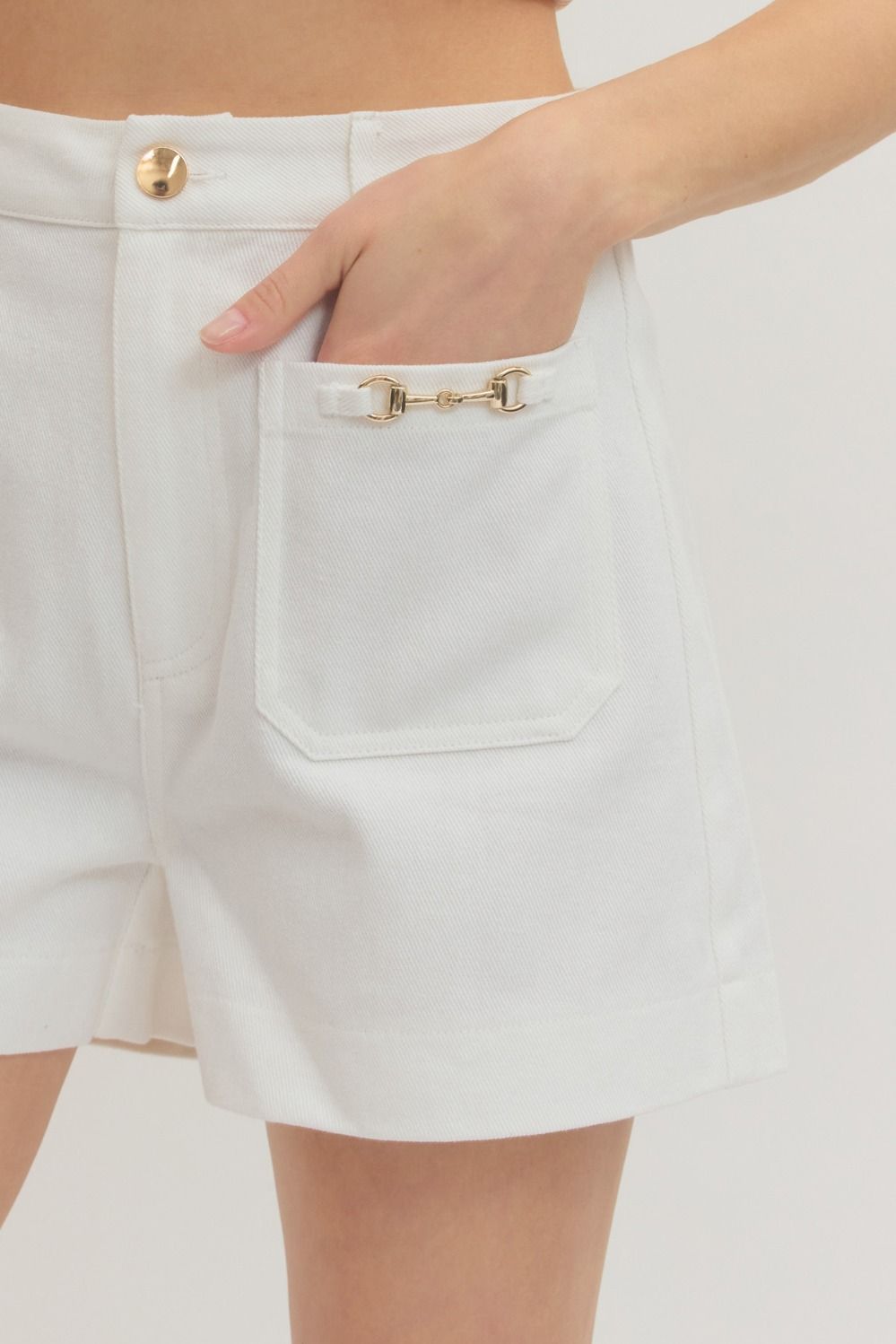 White Horse-bit Detail HW Shorts with gold button and horse-bit accent on pocket. Available in sizes XS-XL.