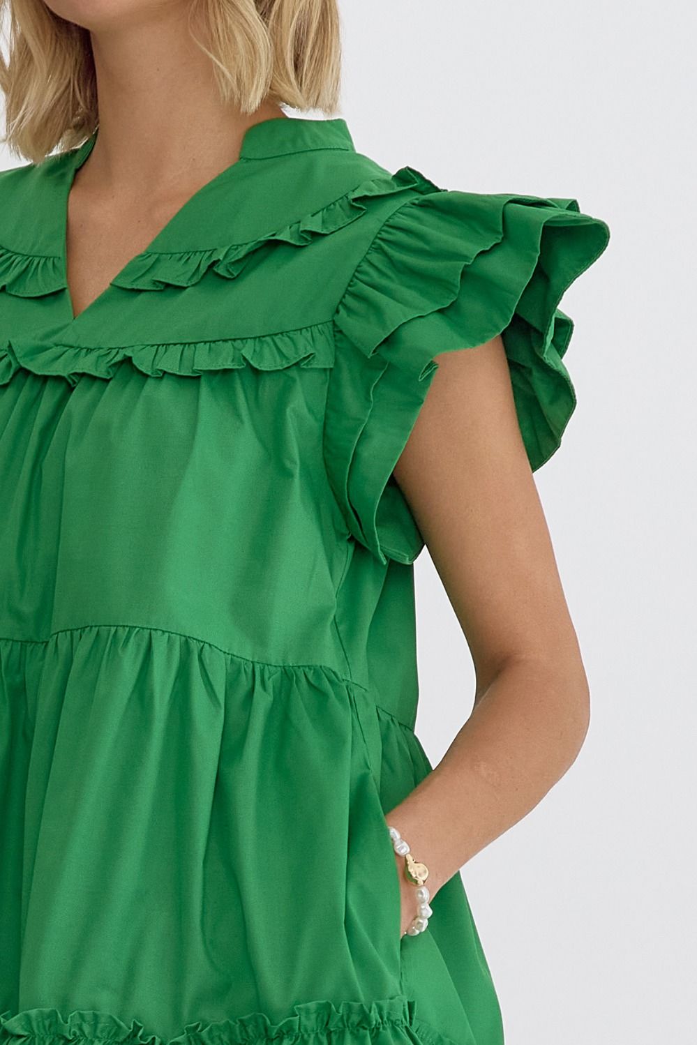 Daphne Meadow Bloom Dress with bright green ruffle sleeves, tiered layers. Available in XS–XL.