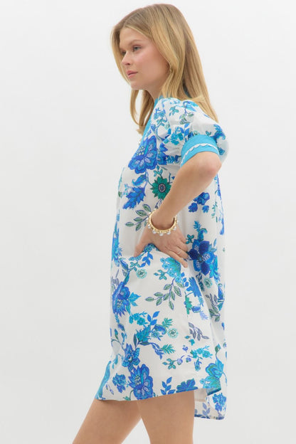 Blue Blossom Caftan Mini Dress with blue and turquoise floral patterns, A-line silhouette. Sizes: XS, S, M, L, XL.