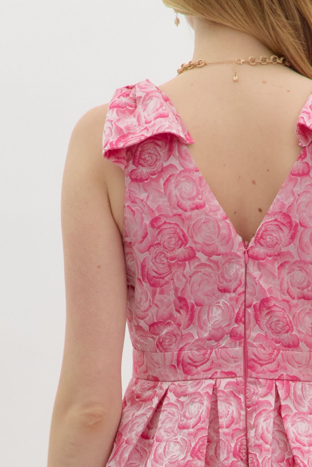 Carly Floral Print Bow Accent Midi Dress: Sleeveless pink floral textured fabric, ruffled shoulders, V-shaped back, bow accent. Available in sizes XS-L.