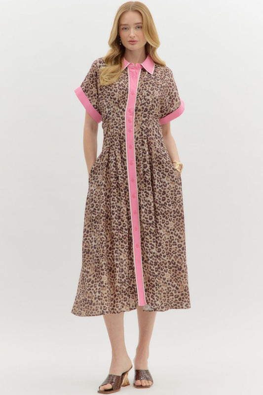 Michele Leopard Print Midi Dress: Short-sleeve midi dress with leopard print and bright pink trim on the collar, button placket, and sleeves. Features side pockets. Available in sizes XS–XL.