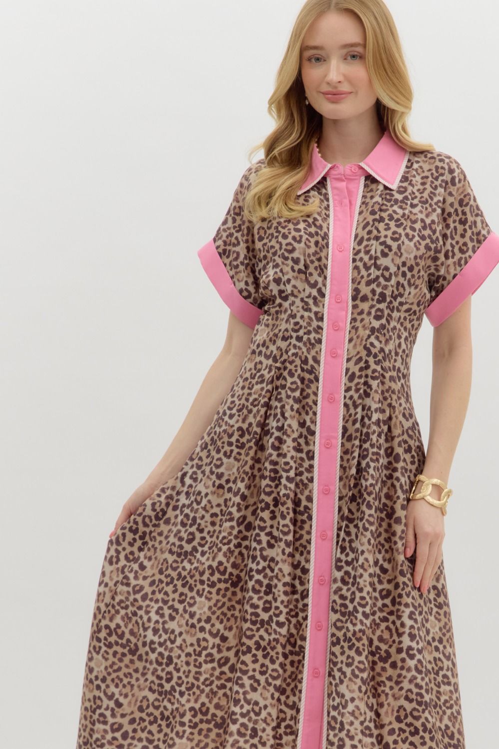 Michele Leopard Print Midi Dress: Short sleeve midi dress with leopard print and bright pink accents on collar, sleeves, and button placket. Available in sizes XS, S, M, L, XL.