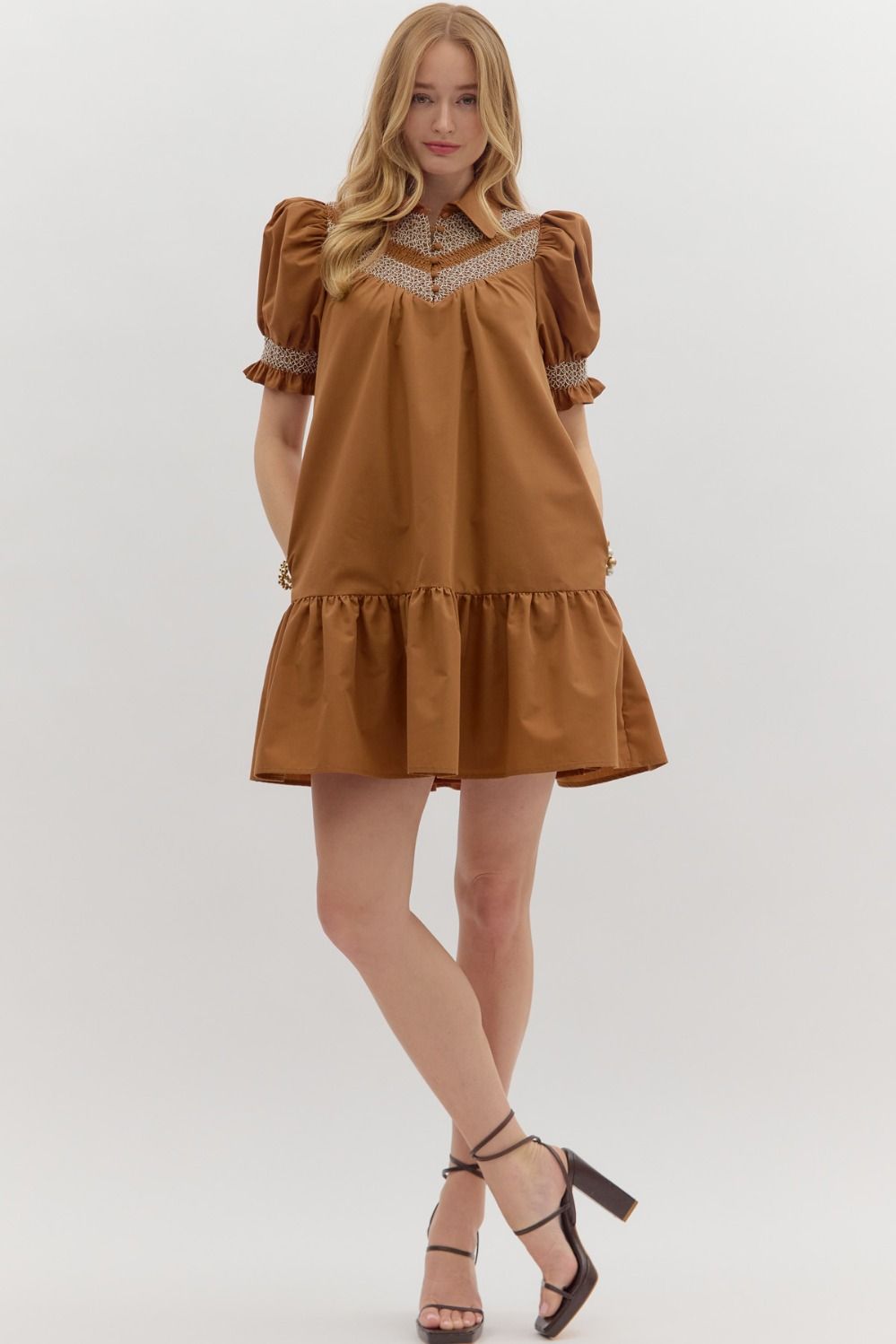 Sylvie Golden Hour Dress: short, loose caramel dress with puffed sleeves, lace neckline, ruffled hem. Available in XS–XL.