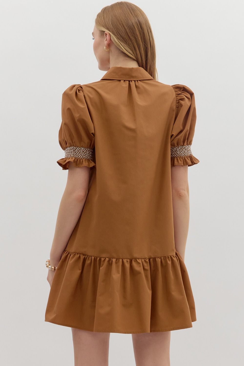 Sylvie Golden Hour Dress: short caramel dress with puff sleeves, collar, smocked cuffs, ruffled hem. Sizes XS–XL.