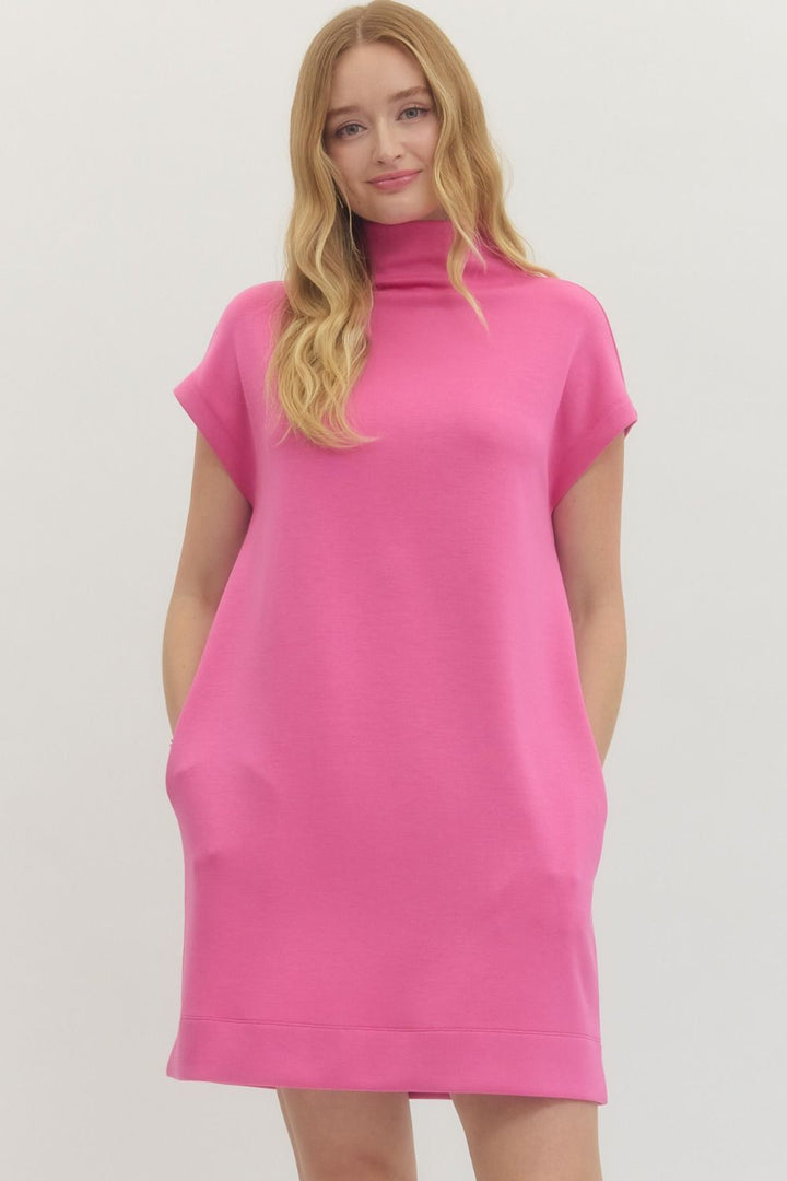 Pink Solid Mock Neck Pullover Dress: loose fit, short sleeves, knit fabric, pockets. Available in sizes XS–XL.