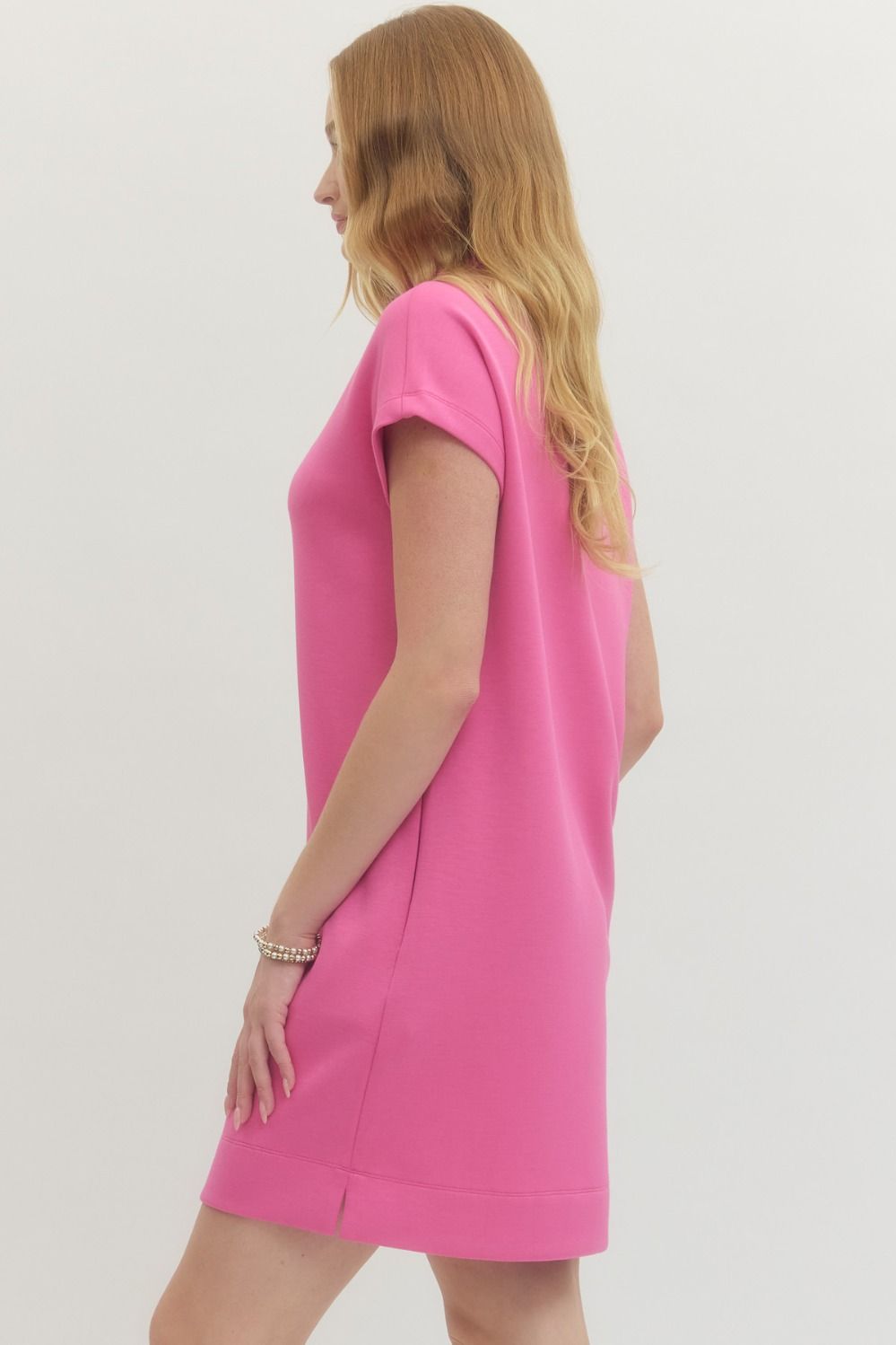 Pink Solid Mock Neck Pullover Dress with mock neckline and long sleeves. Available in sizes XS–XL.