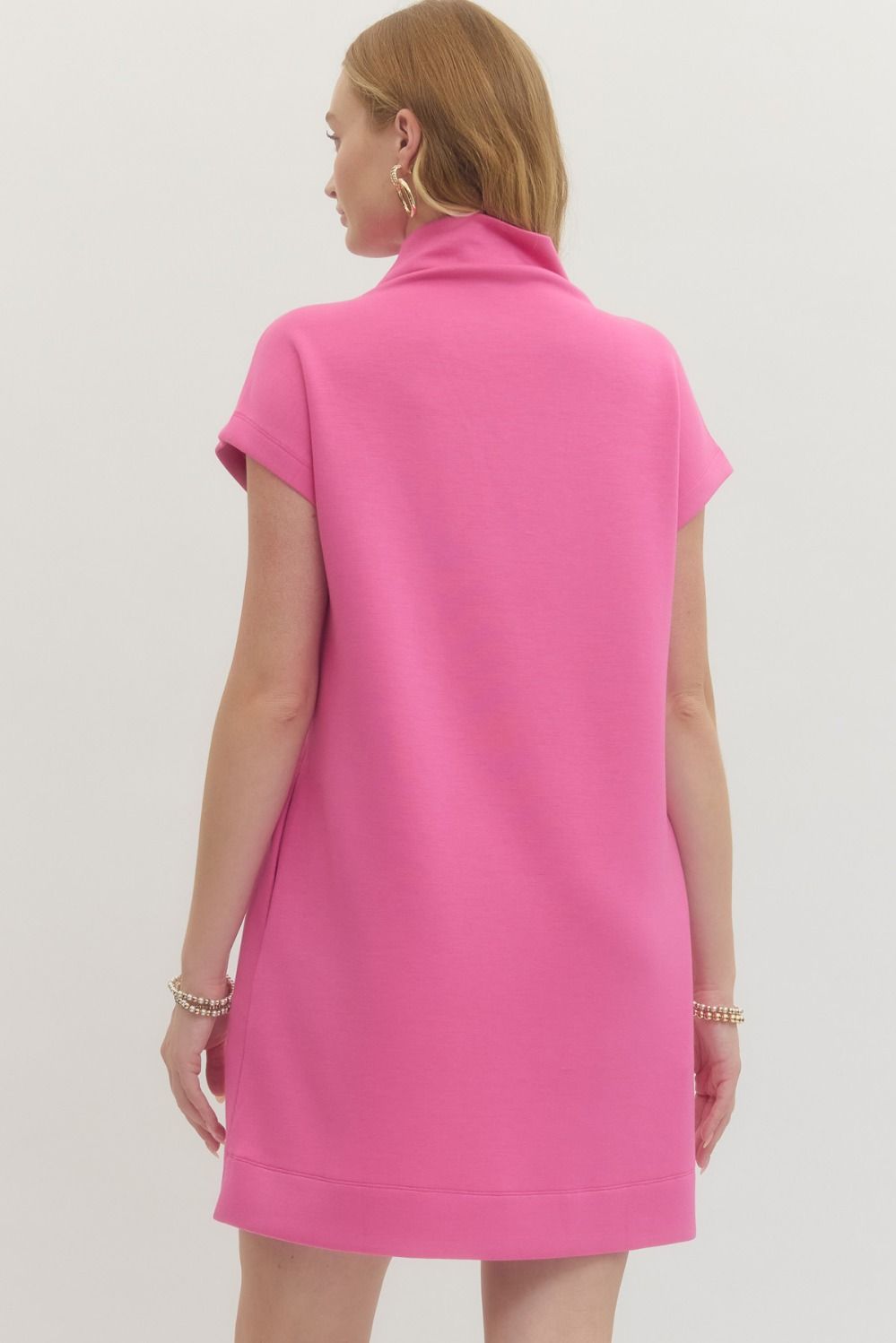 Pink Solid Mock Neck Pullover Dress, short sleeves, knee-length. Bright pink. Available in sizes XS–XL.