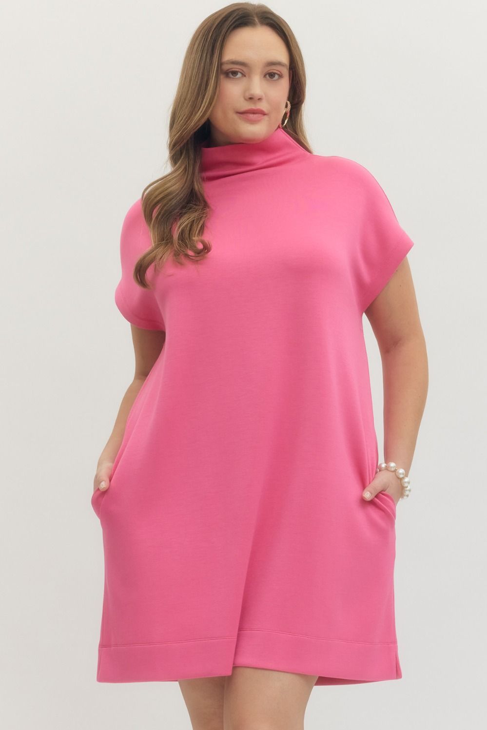 Pink Solid Mock Neck Pullover Dress with short sleeves and pockets; available in sizes XS-XL.