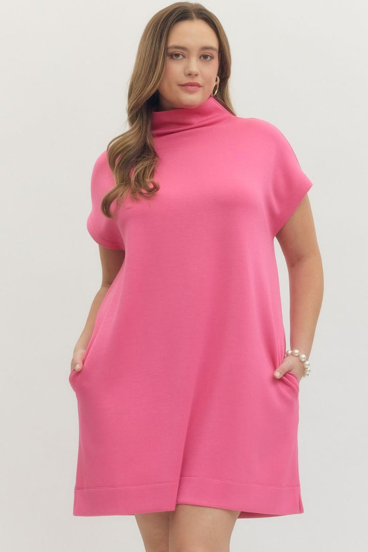 Pink Solid Mock Neck Pullover Dress with short sleeves and pockets; available in sizes XS-XL.