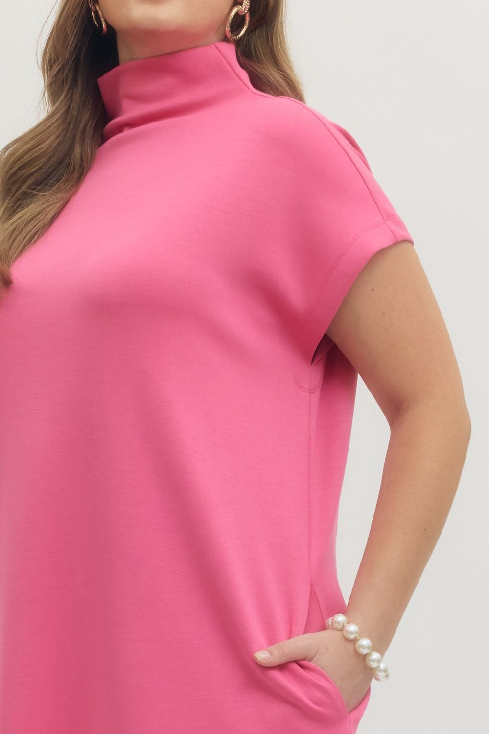 Pink Solid Mock Neck Pullover Dress; available in sizes XS-XL.