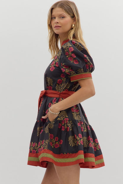 Angie Floral Puff Sleeve Ruffle Hem Dress with puffed sleeves, red waist tie, flared skirt; sizes XS–XL.