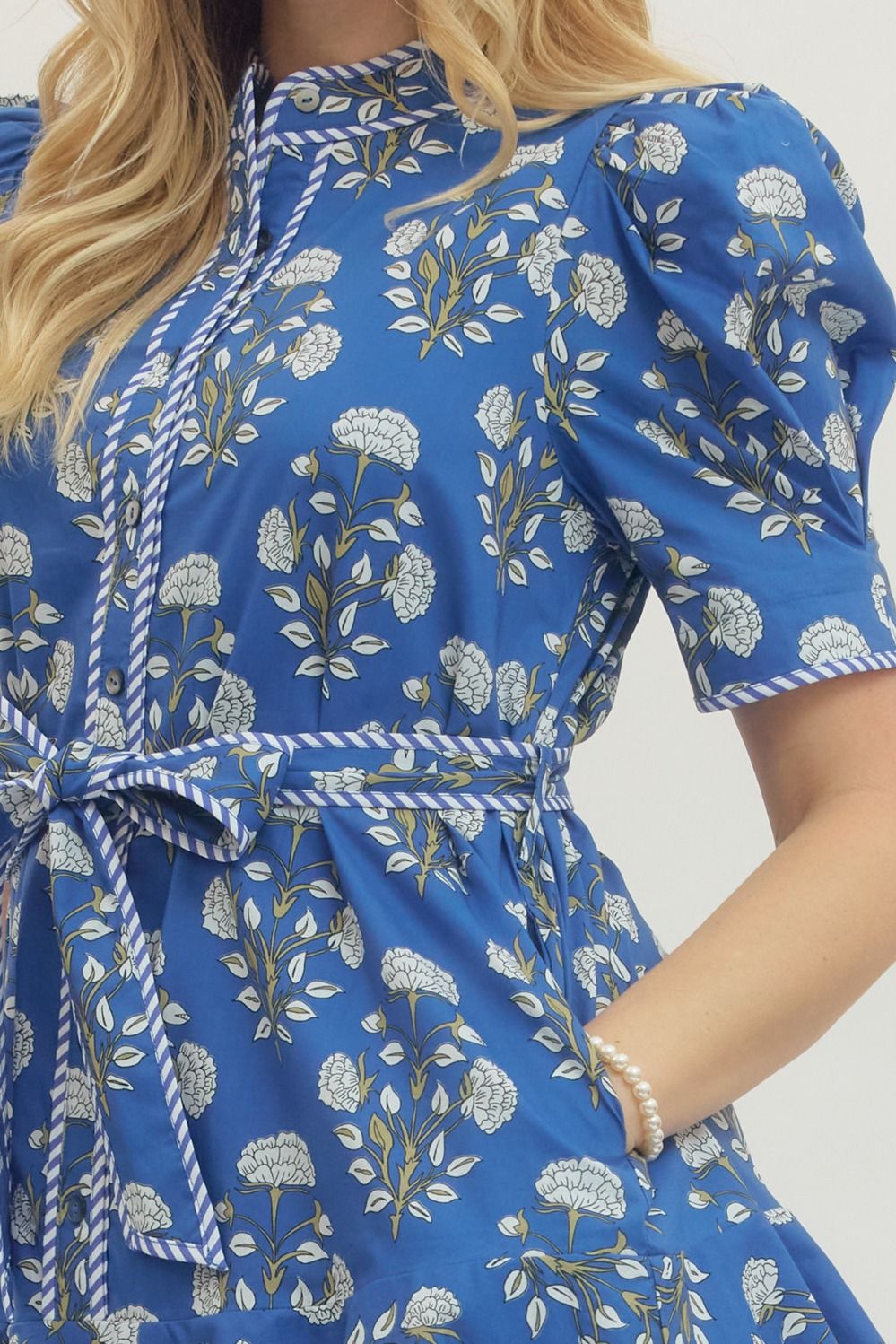 Blue Floral Print Belted Dress with puffed sleeves and self-tie belt. Available in sizes XS-XL.