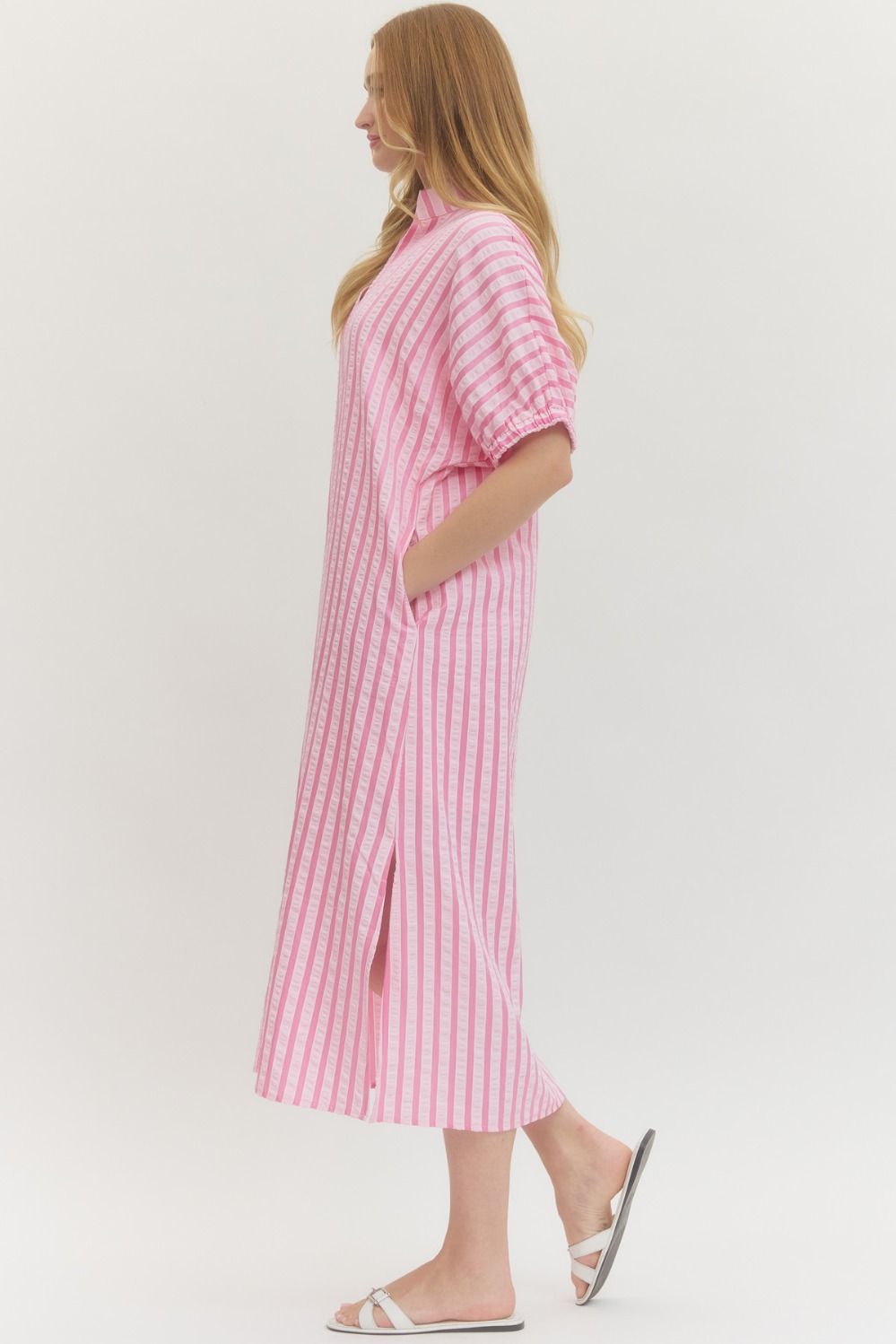 Pink Striped Seersucker Midi Dress with sleeves, side slits, and pockets. Lightweight for spring. Available in sizes XS-XL.