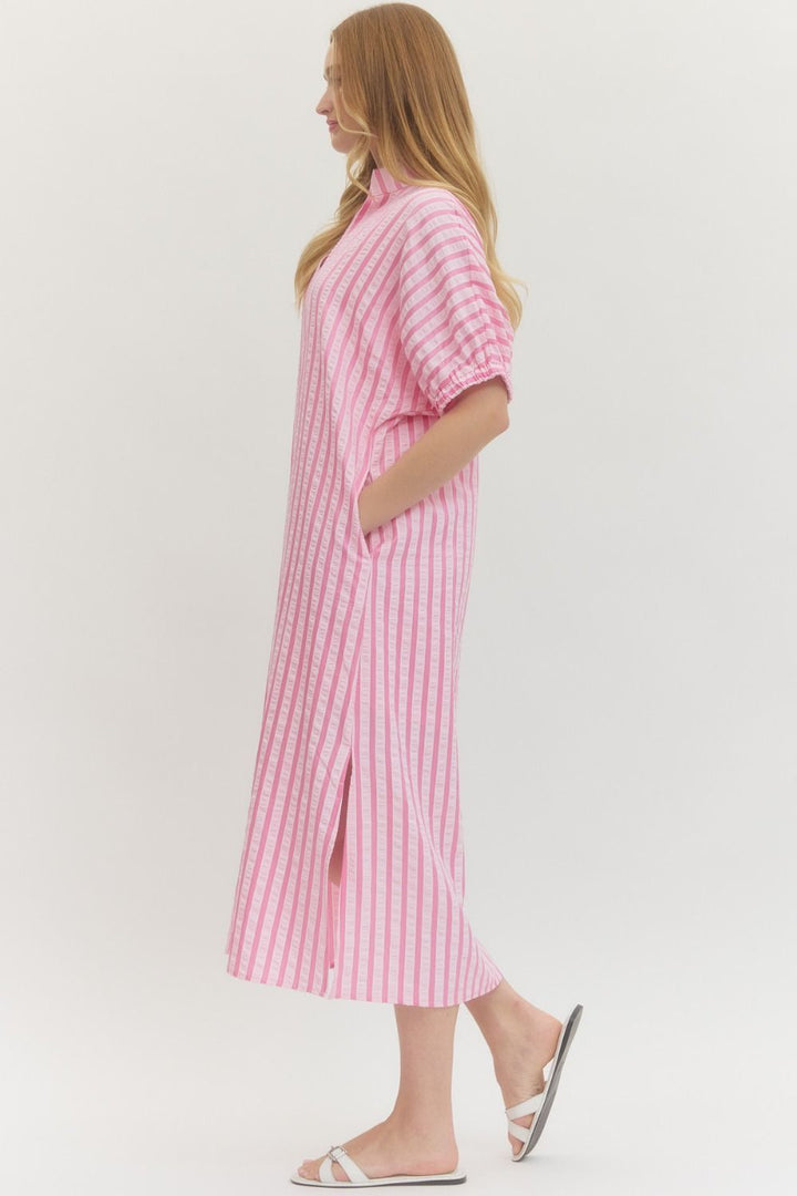 Pink Striped Seersucker Midi Dress with sleeves, side slits, and pockets. Lightweight for spring. Available in sizes XS-XL.