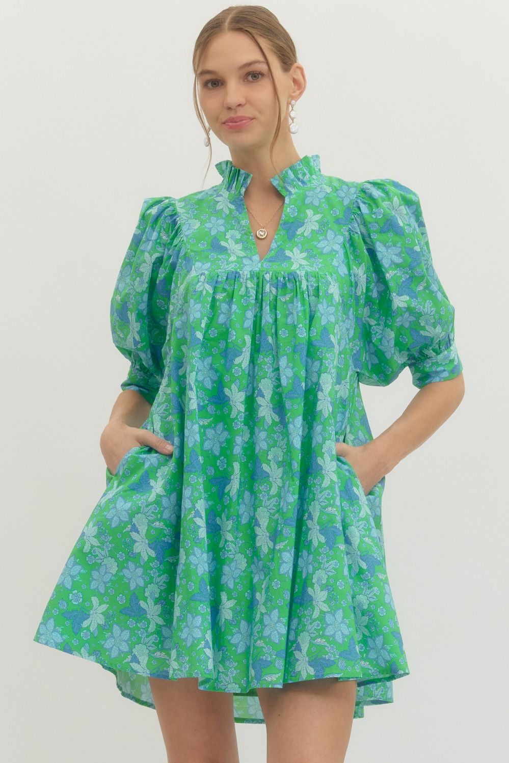 Green floral print ruffle stand collar dress with puffed sleeves, loose fit, pockets. Available in sizes XS-XL.
