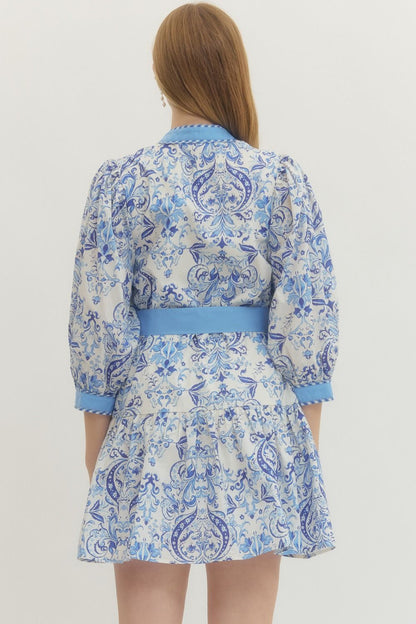 Royal Printed Long Sleeve Belted Dress with blue and white prints, fitted waist. Available in sizes XS-XL.
