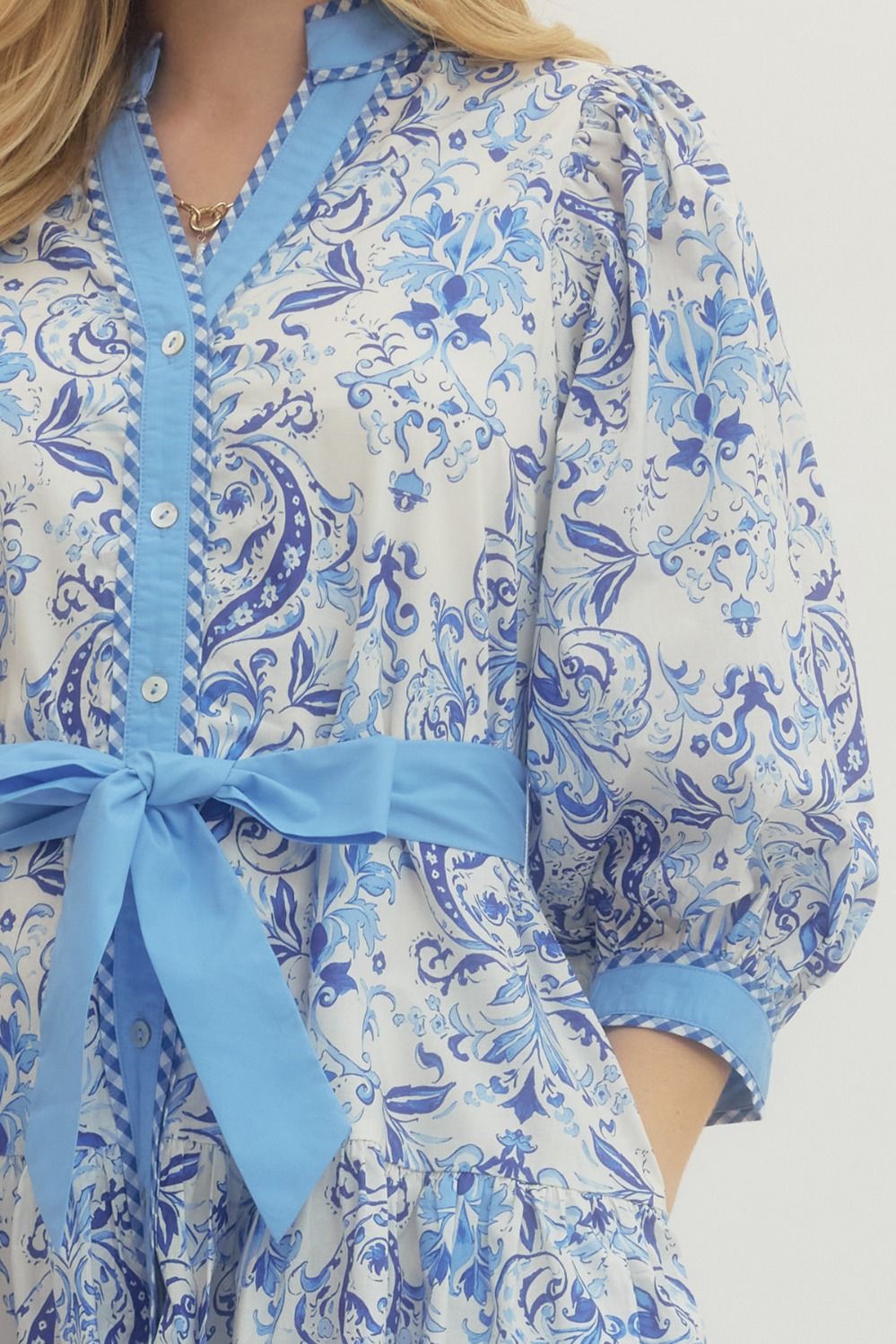 Royal Printed Long Sleeve Belted Dress: white with blue floral/paisley, blue trim, buttons, waist tie. Sizes: XS–XL.