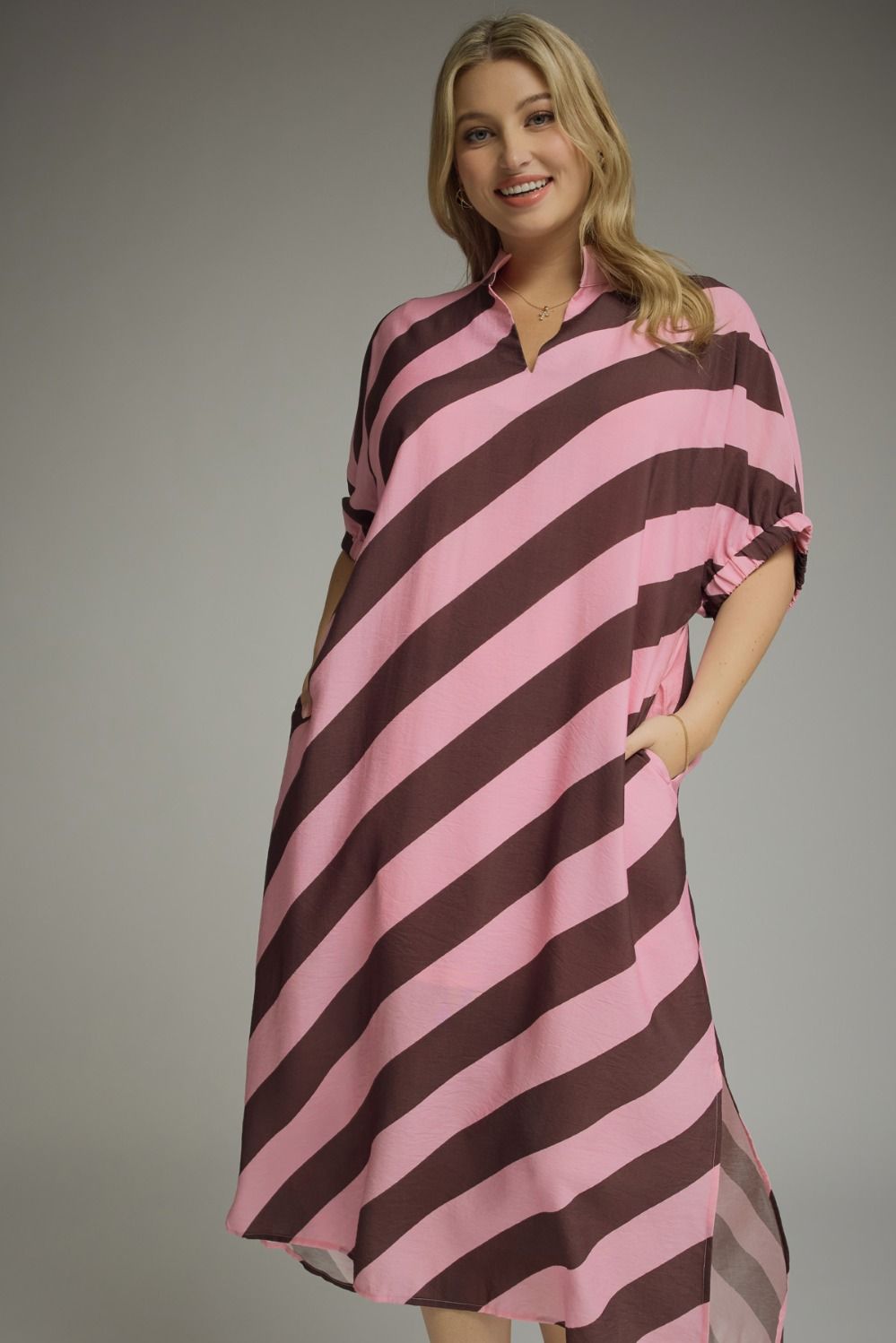 Rosewood Stripe Midi Dress: loose fit, knee-length, pink and brown stripes, short sleeves, pockets. Available in sizes XS-XL.