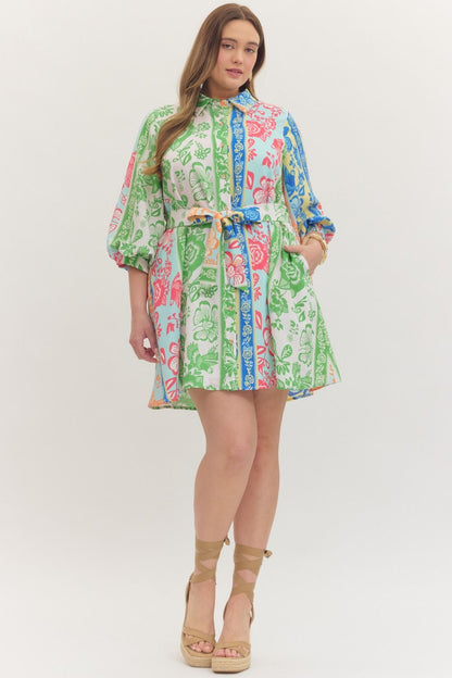 On Vacation Time Dress: knee-length plus size, green/blue/pink botanical stripes, belted waist, puff sleeves. Sizes 1X–4X.