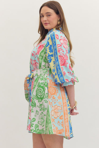 On Vacation Time Dress: plus size, colorful botanical stripe print, tie waist, elbow-length sleeves. Sizes 1X-4X available.