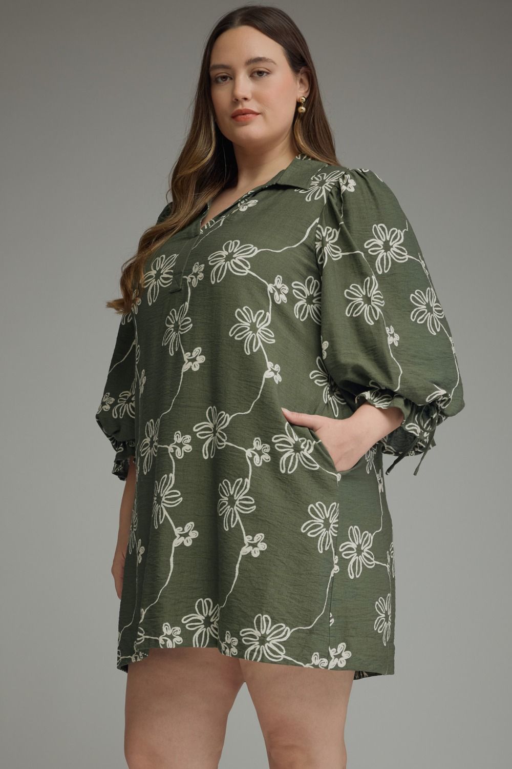 Olive Bloom Tie Waist Dress with olive green floral print and balloon sleeves; available in sizes XS–XL.