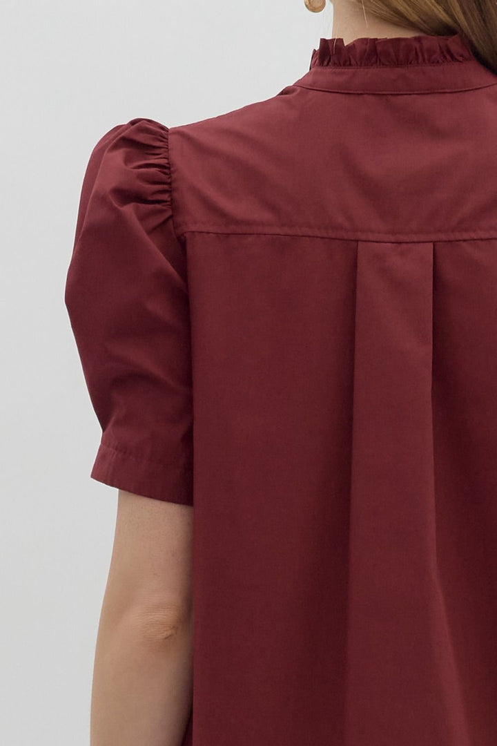 Burgundy Button-Up Bubble Sleeve Blouse with short bubble sleeves and ruffled collar. Available in sizes XS-XL.