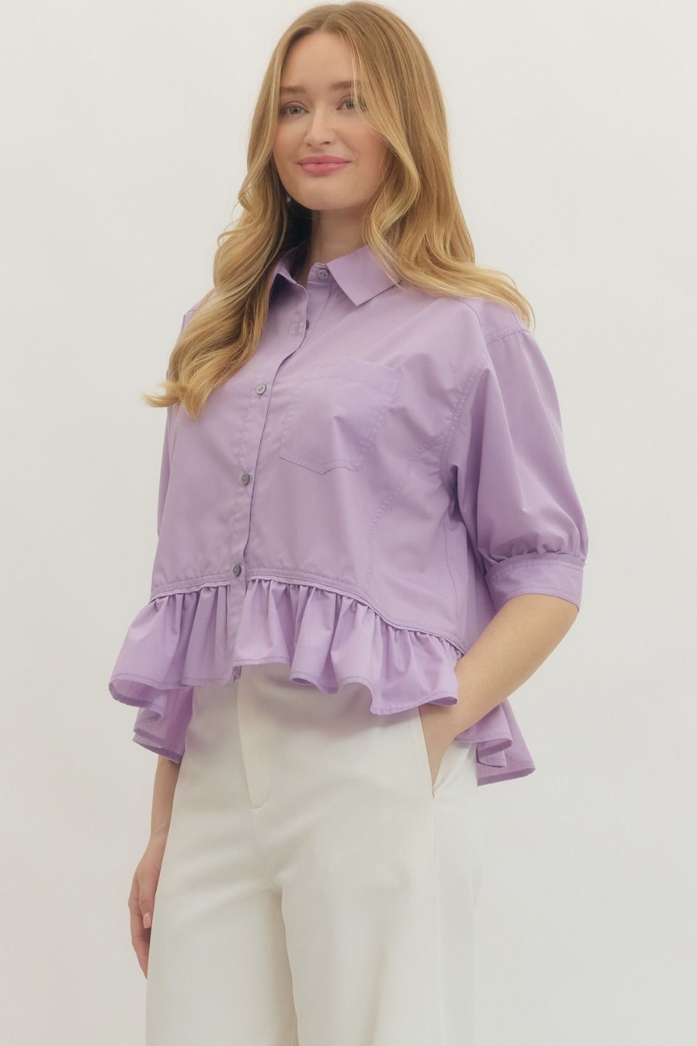 Lavender Ruffle Hem Button-Up Top, available in sizes XS–XL. Features ruffle hem and front buttons.