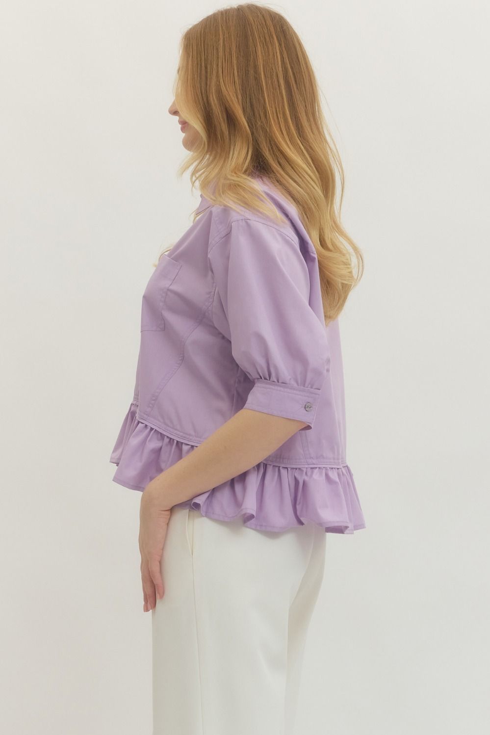 Lavender Ruffle Hem Button-Up Top with short puff sleeves. Available in sizes XS-XL.