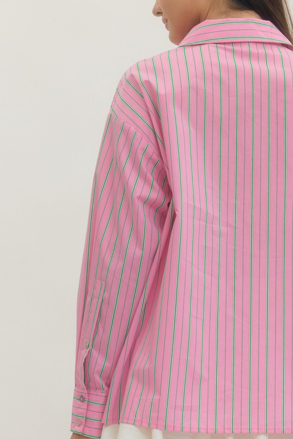 Pink and Green Striped Button-Up Blouse with pink, green, and white vertical stripes. Available in sizes XS–XL.
