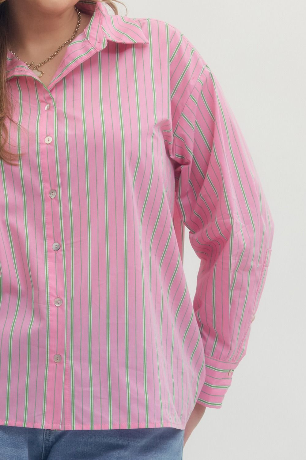 Pink and Green Striped Button-Up Blouse, available in sizes XS-XL. Features vertical stripes and classic collar.