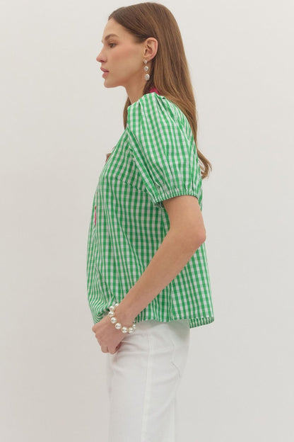 Green and white gingham puff sleeve top, 100% cotton, ruffled stand collar. Available in sizes XS-XL.