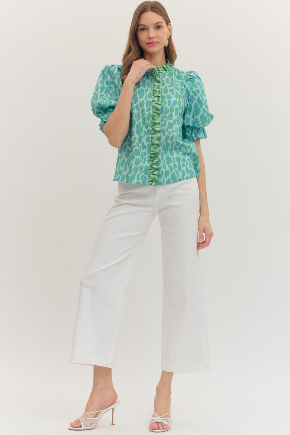 Green Leopard Puff Sleeve Ruffle Top with ruffle details and puff sleeves. Available in sizes XS–XL.