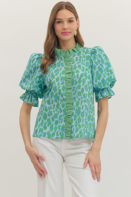 Green Leopard Puff Sleeve Ruffle Top with bold print and ruffled details. Available in sizes XS-XL.