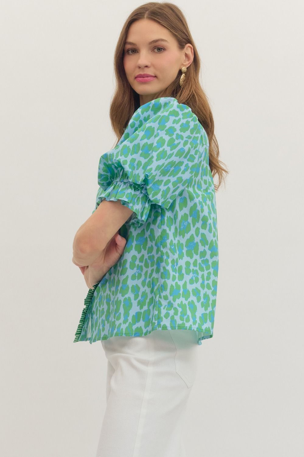 Green Leopard Puff Sleeve Ruffle Top, available in sizes XS–XL. Features bold print and ruffled puff sleeves.