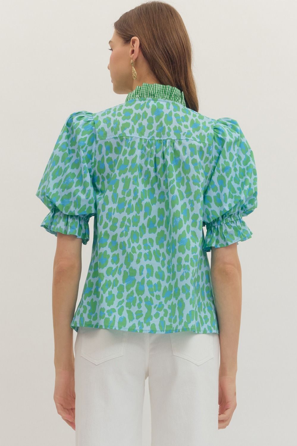 Green Leopard Puff Sleeve Ruffle Top with blue spots, ruffled high collar, and short sleeves. Available in sizes XS–XL.