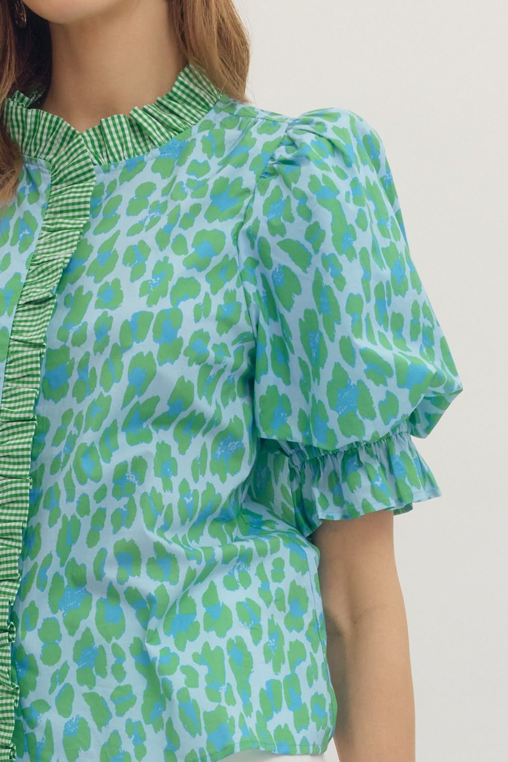 Green Leopard Puff Sleeve Ruffle Top: light blue with green/blue leopard print, puff sleeves, ruffled collar. Sizes XS-XL.