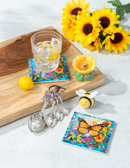 Garden-themed decor set with butterfly coaster, daisy dish, bee figurine, and bow measuring spoons. Sizes: small–large.