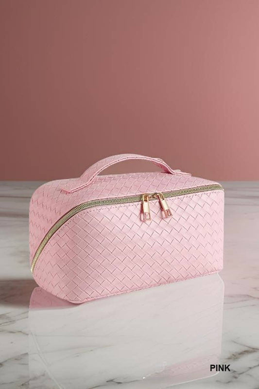 Ivory woven vegan leather makeup bag in light pink with textured design, handle, and gold zipper. Available in small and large.